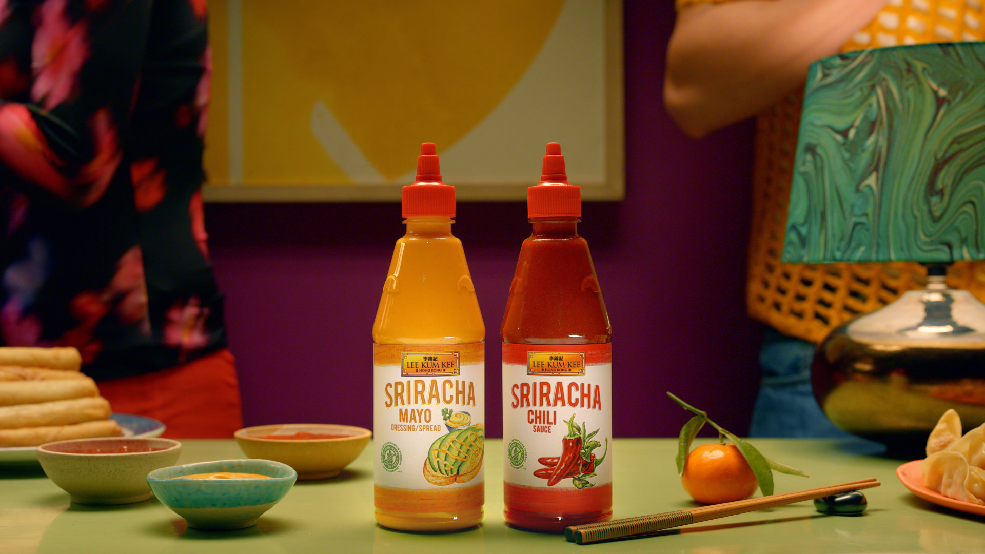 Lee Kum Kee Sriracha Mayo and Chili bottles on table