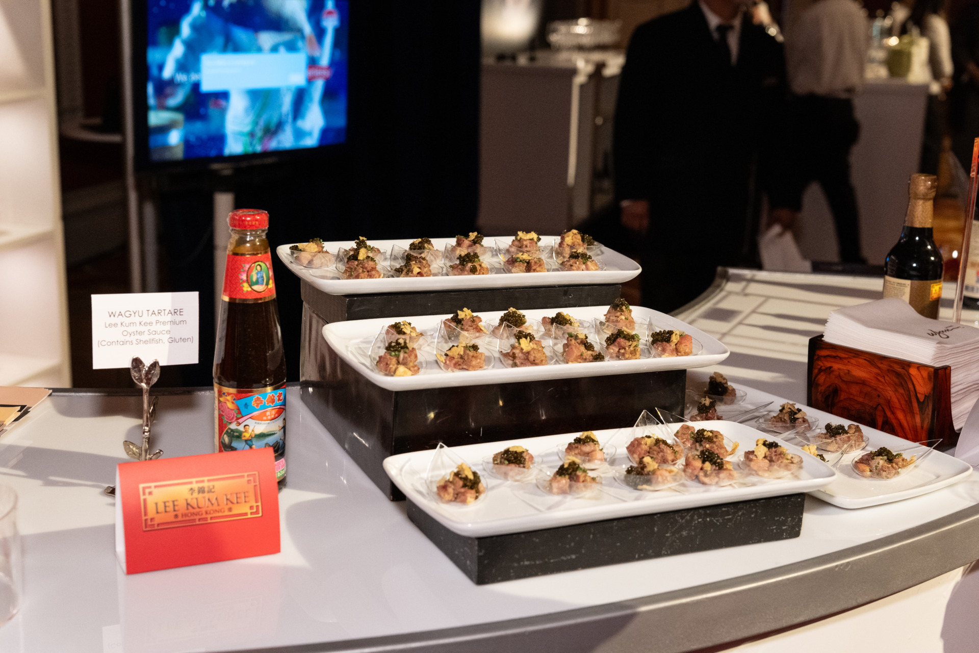 Display of beef tartare with a bottle of Lee Kum Kee’s Premium Oyster Sauce